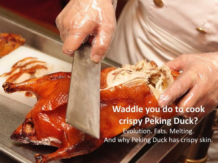 Chef slicing crisy Peking Duck skin