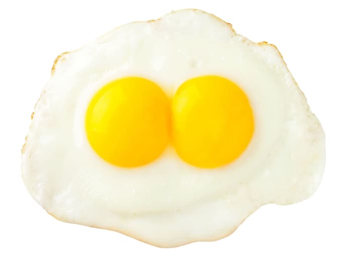 denaturation - Fried eggs that look like funny face isolated on white background