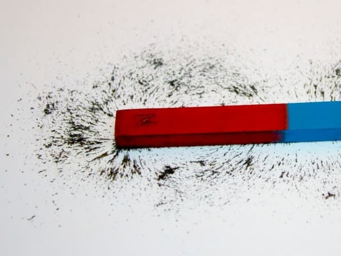 induction stoves rely on ferromagnetism: Bar magnet. Iron filings show magnetic field lines.