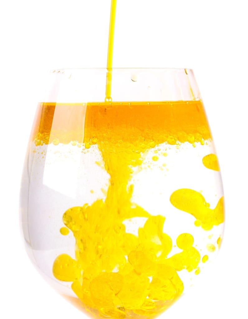 Olive oil in a glass of water - not mixing