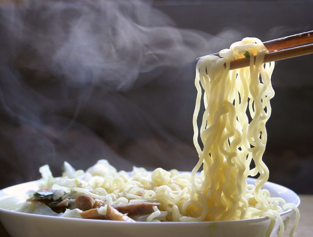the white "steam" above hot soup, drink or noodles is actually fog
