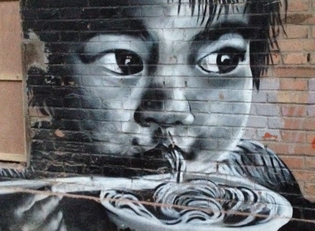 Mural of Asian child slurp a bowl of noodles
