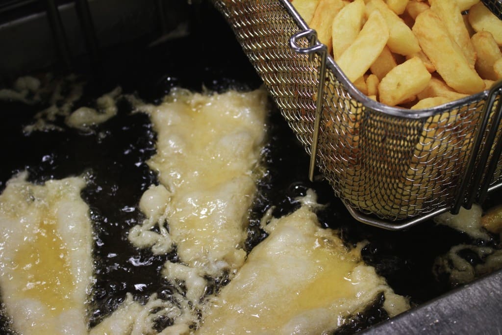 deep frying beer battered fish and chips