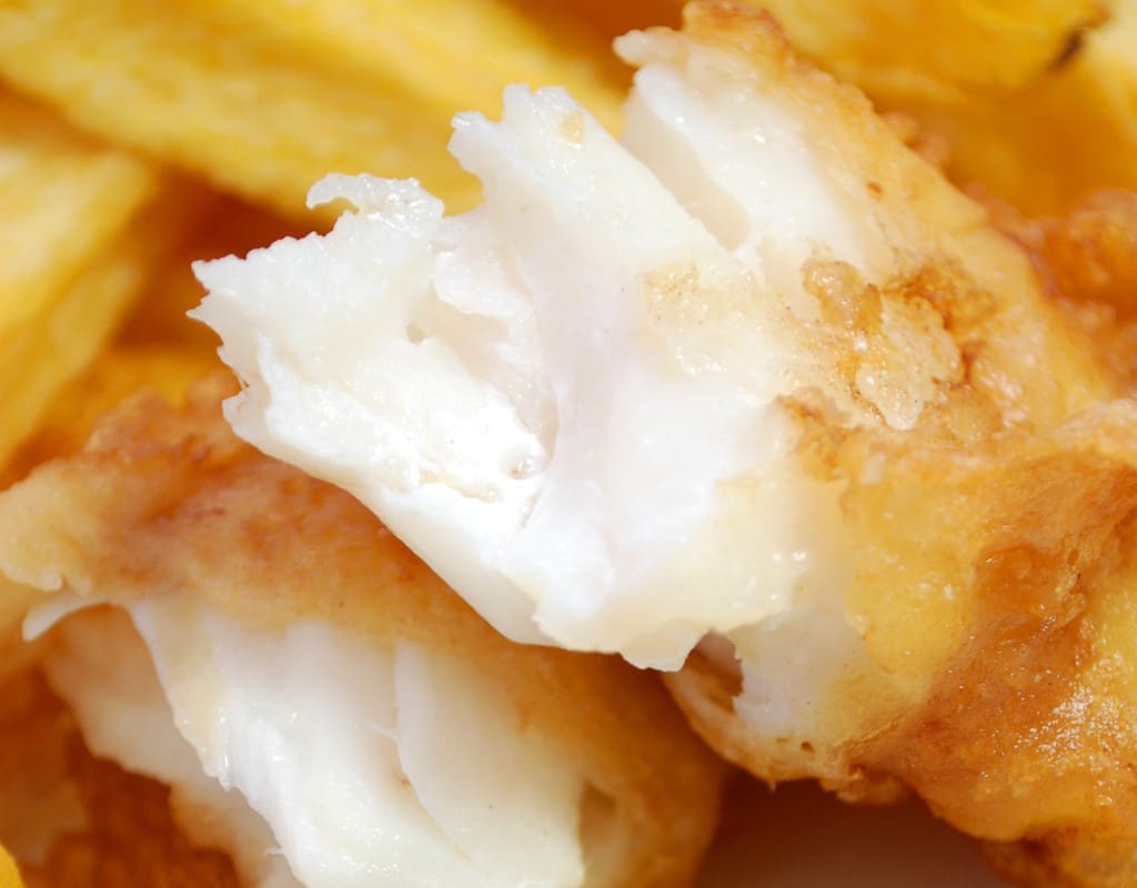 moist and tender insides of beer battered fish and chips