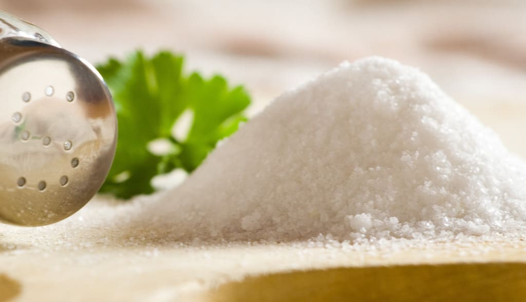 osmosis and diffusion - Sea salt on cloth and wooden plate in kitchen.