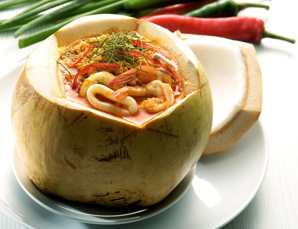 coconut as outer vessel - Thai Food Tom Yum seafood