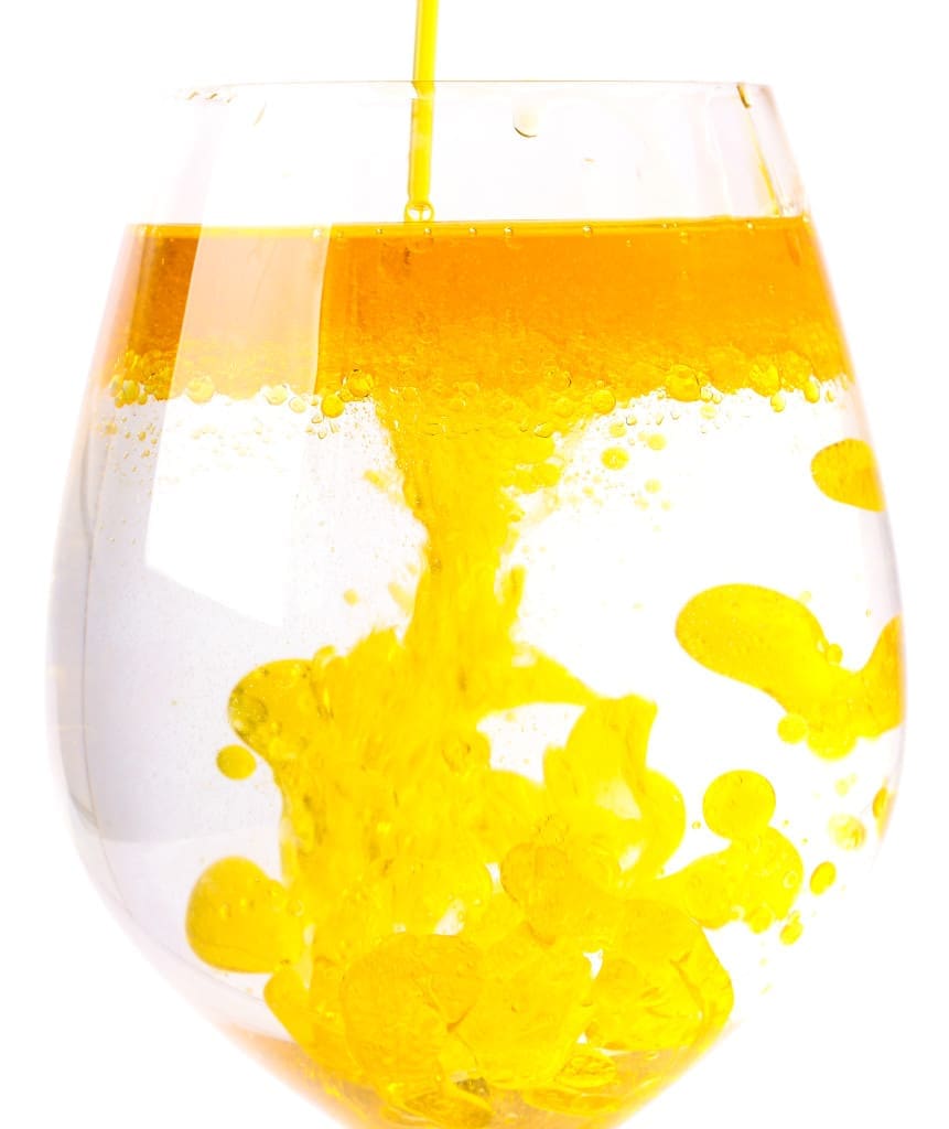 Olive oil in a glass of water - not mixing