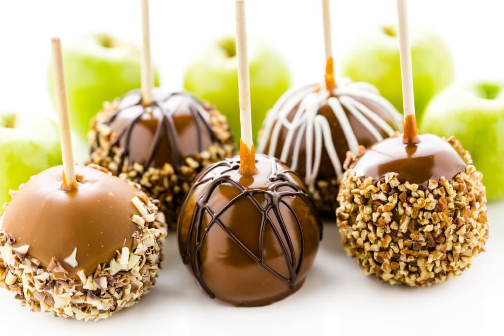 Hand dipped caramel apples decorated for Halloween.