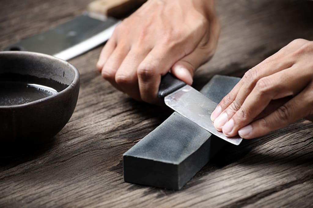 friction - sharpening the knife with whetstone