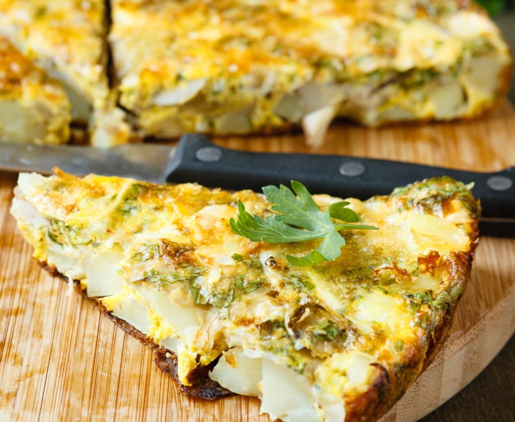 intermolecular forces - Frittata slices on a cutting board and knife, food close up