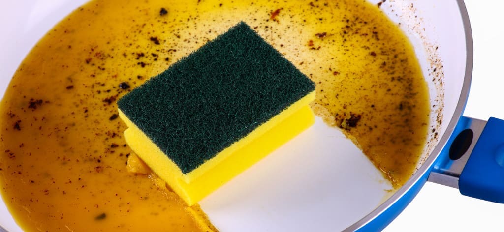 soap and oil and water on dirty dish