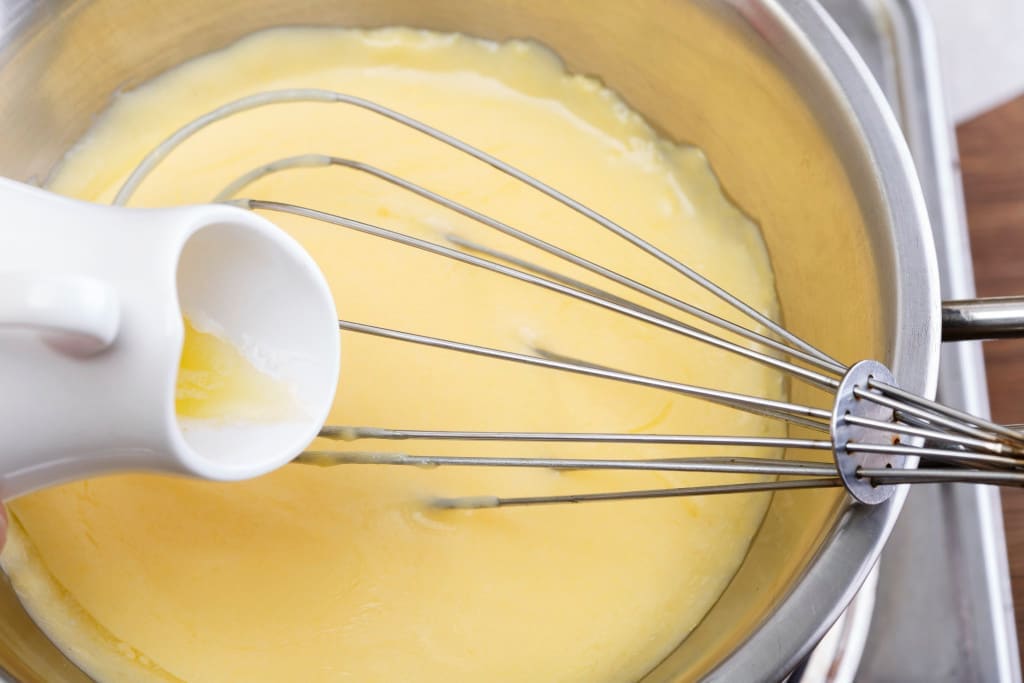 Hollandaise sauce cooked in a bain marie or water bath