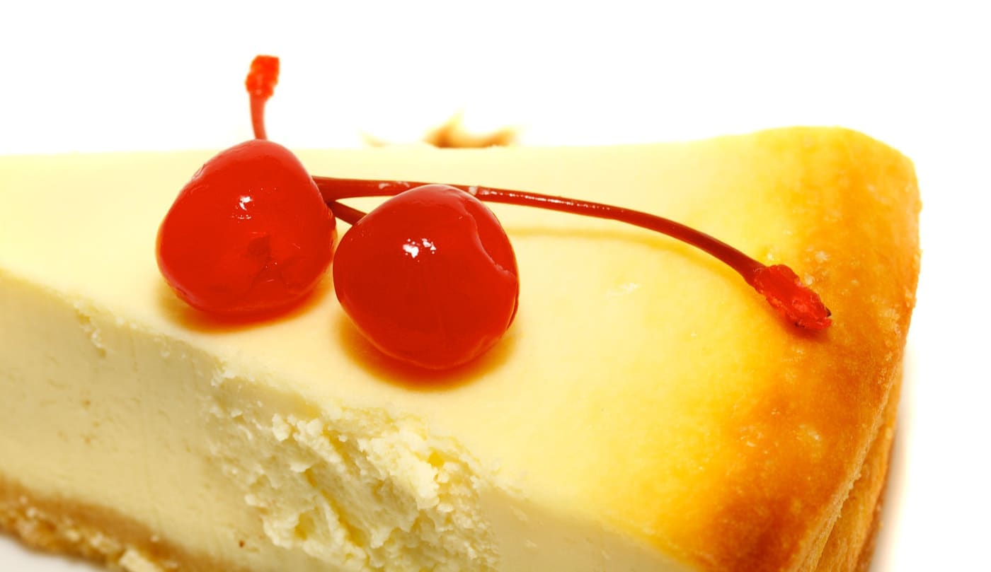 Gourmet slice of cheesecake on the white background