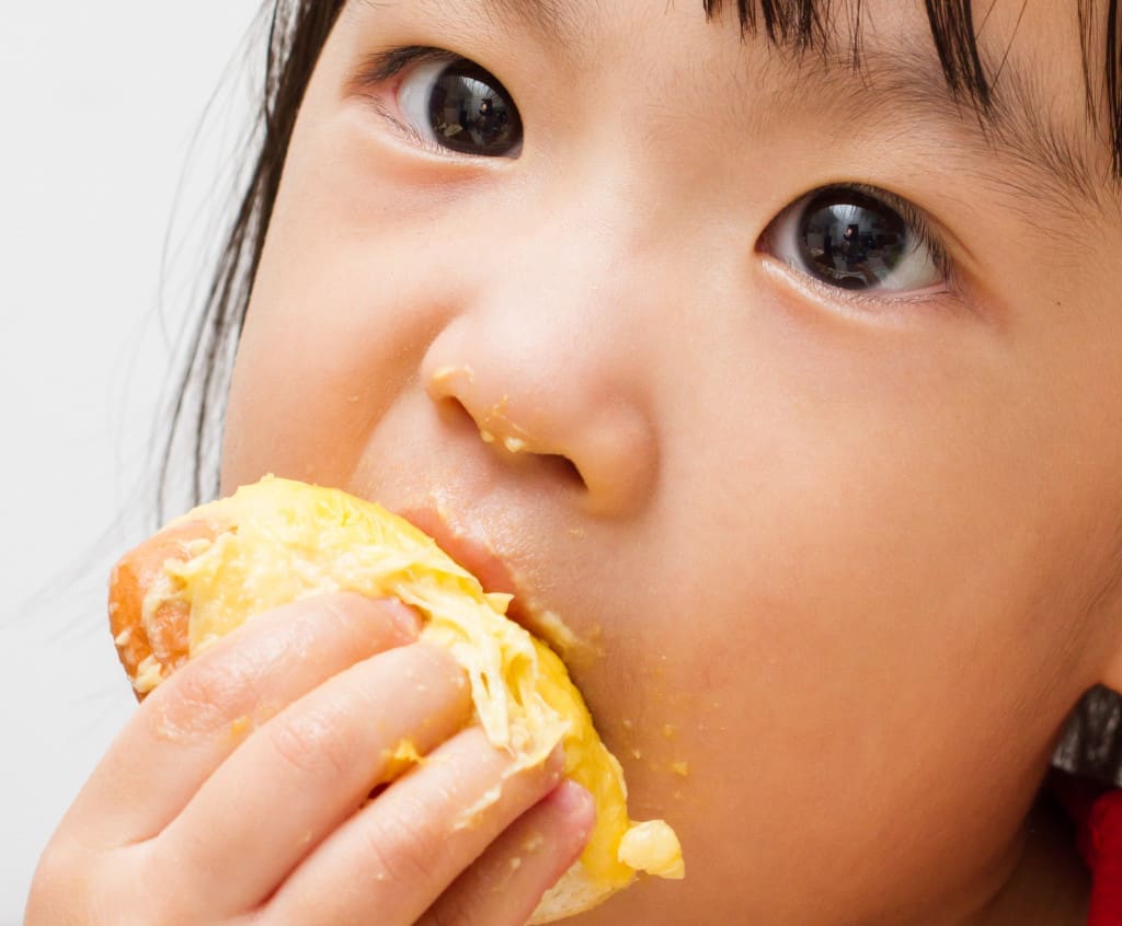 Asian Chinese little girl eating durian fruit