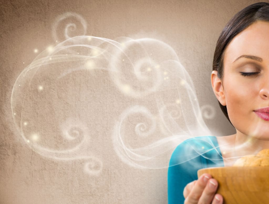 Beautiful woman holding hot fresh smelling oat cookies with closed eyes and relaxing. Retro stylized enjoying food poster with place for your text on grunge background