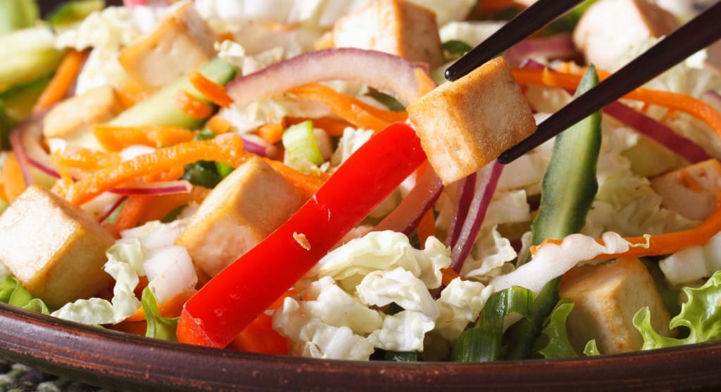 A pair of chopsticks can be used to prepare food too, such as tossing a salad