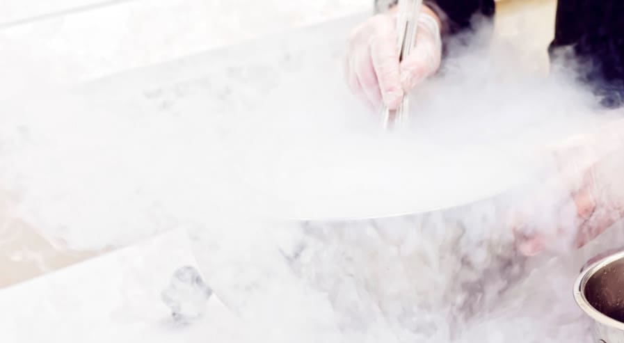 Chef is cooking ice cream with liquid nitrogen, toned