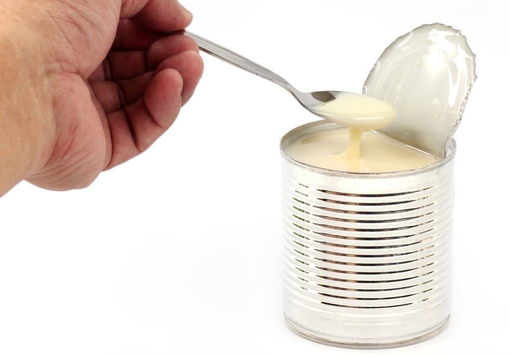 Can of sweetened condensed milk isolate on white background