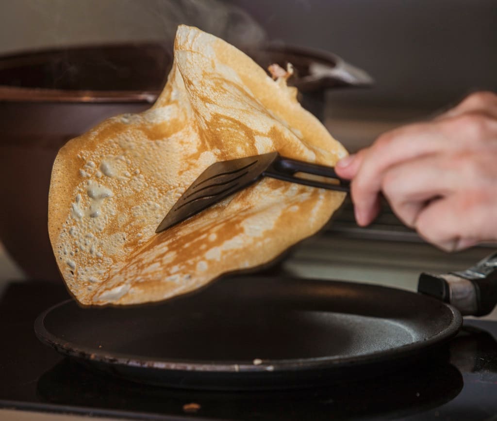 flipping pancakes with a spatula